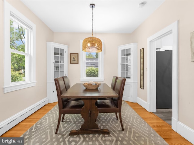 206 Shiley St, Annapolis, MD 21401 - dining room with a baseboard radiator, light wood-type flooring, and baseboards