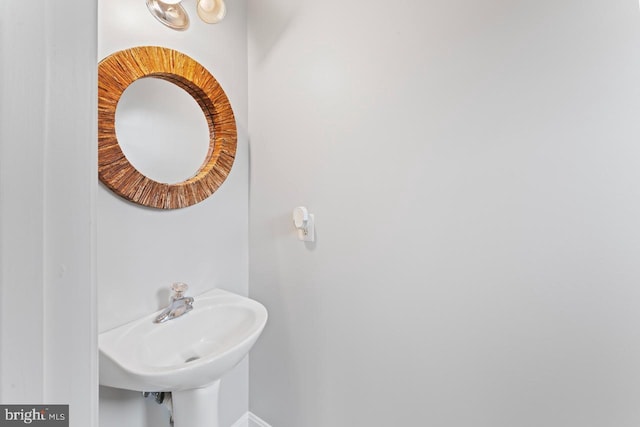 5971 Schooner Cir, King George, VA 22485 - bathroom featuring a sink and baseboards
