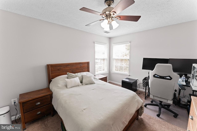 5971 Schooner Cir, King George, VA 22485 - bedroom featuring carpet floors, a textured ceiling, a desk, a ceiling fan, and baseboards