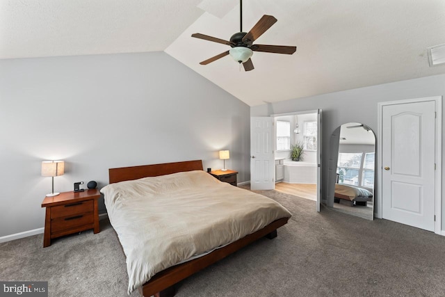 5971 Schooner Cir, King George, VA 22485 - carpeted bedroom featuring lofted ceiling, ceiling fan, connected bathroom, baseboards, and arched walkways