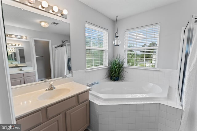 5971 Schooner Cir, King George, VA 22485 - bathroom with a garden tub, a shower with shower curtain, and vanity