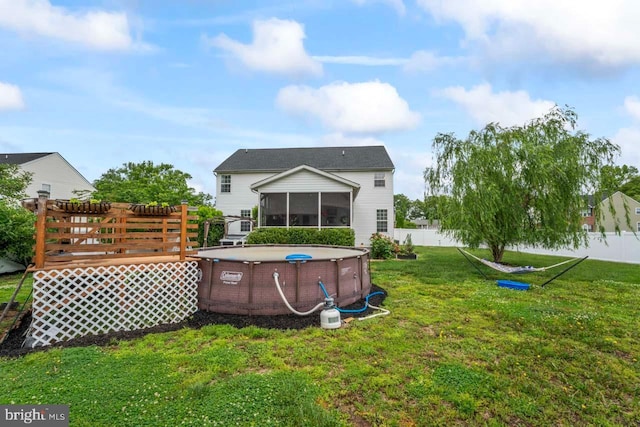 5971 Schooner Cir, King George, VA 22485 - rear view of house featuring a sunroom and a wooden deck