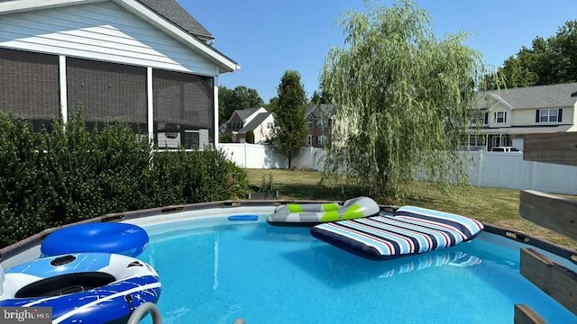 5971 Schooner Cir, King George, VA 22485 - view of pool with a fenced backyard and a sunroom