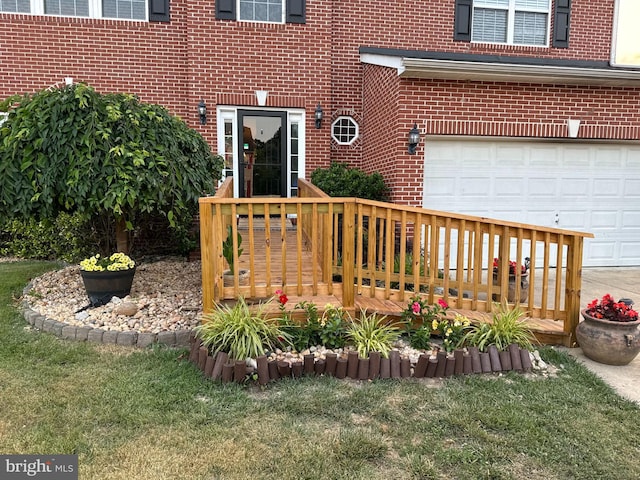 5971 Schooner Cir, King George, VA 22485 - entrance to property featuring brick siding, a garage, a deck, and a yard