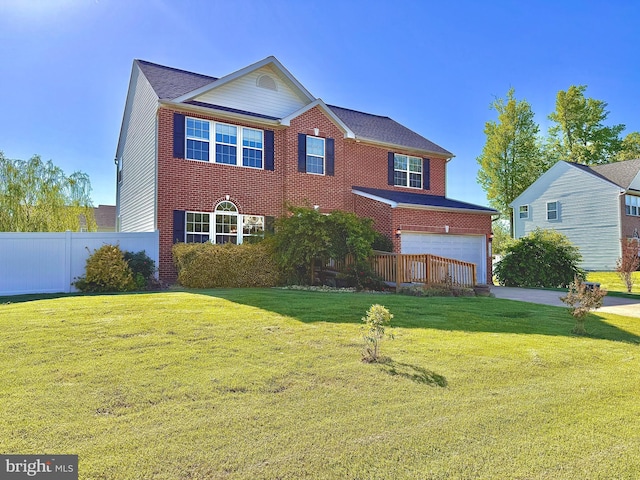 5971 Schooner Cir, King George, VA 22485 - traditional home with an attached garage, brick siding, and driveway