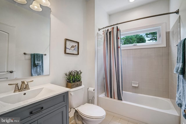 bathroom featuring shower / tub combo, toilet, vanity, and tile patterned floors