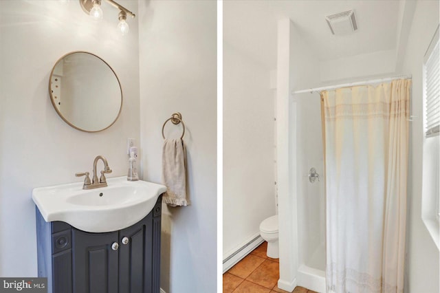 bathroom with toilet, vanity, visible vents, a baseboard radiator, and tile patterned flooring