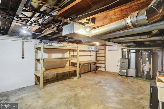 unfinished below grade area with heating unit and gas water heater