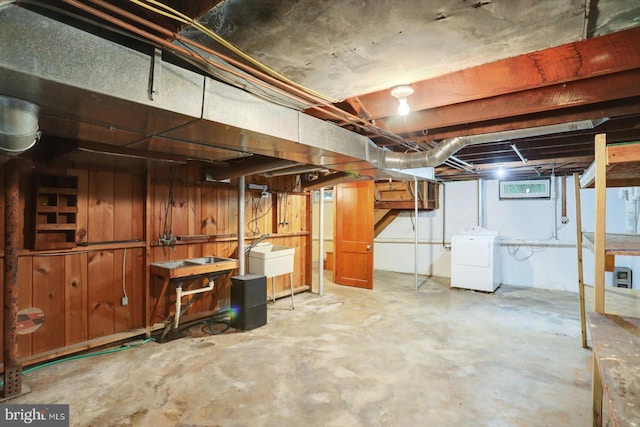 below grade area featuring washer / dryer