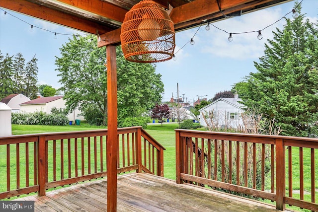 wooden deck with a lawn