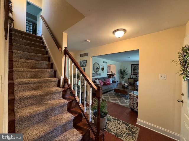 926 Pierce Rd, Norristown, PA 19403 - staircase with wood finished floors and baseboards