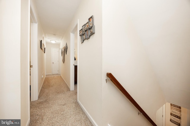 926 Pierce Rd, Norristown, PA 19403 - hall with an upstairs landing, light carpet, and baseboards