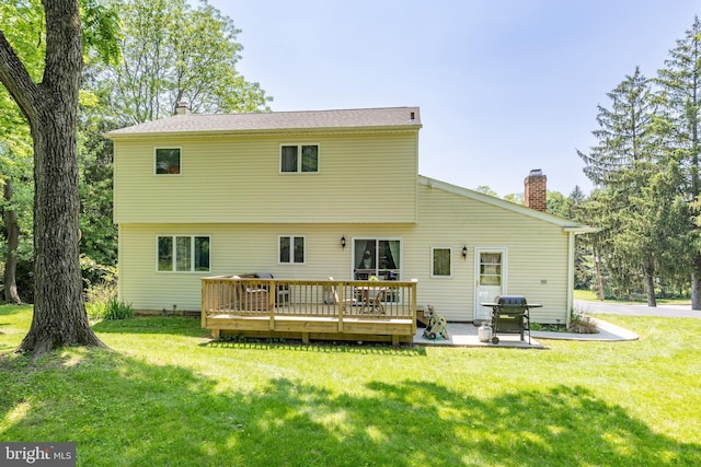 926 Pierce Rd, Norristown, PA 19403 - rear view of house featuring a chimney, a wooden deck, a yard, and a patio area