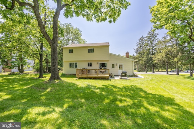 926 Pierce Rd, Norristown, PA 19403 - back of house featuring a chimney, a deck, and a lawn