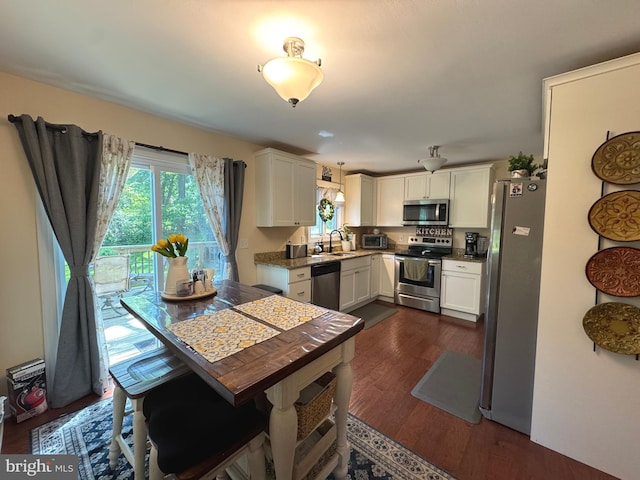 926 Pierce Rd, Norristown, PA 19403 - kitchen with stainless steel appliances, plenty of natural light, white cabinets, and a sink