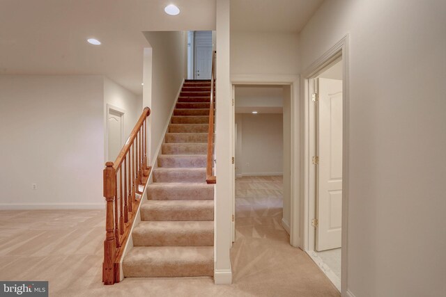 stairway with carpet floors, recessed lighting, and baseboards
