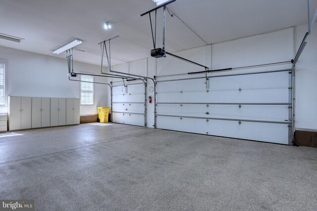 garage featuring a garage door opener