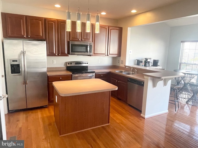1716 Sunningdale Ln, Hanover, MD 21076 - kitchen with stainless steel appliances, wood finished floors, a sink, a peninsula, and recessed lighting