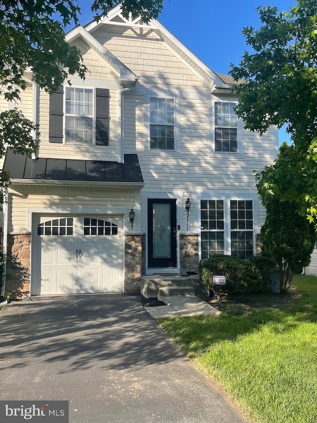 1716 Sunningdale Ln, Hanover, MD 21076 - view of front of property featuring an attached garage, stone siding, and driveway