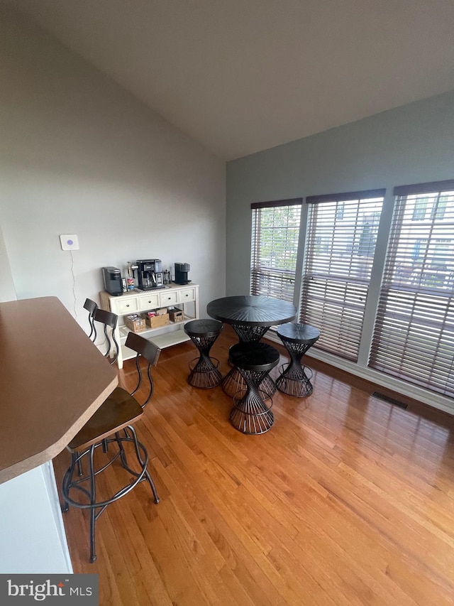 1716 Sunningdale Ln, Hanover, MD 21076 - dining room featuring light wood-style flooring and vaulted ceiling