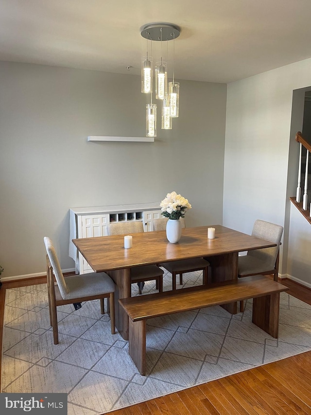 1716 Sunningdale Ln, Hanover, MD 21076 - dining room with light wood-type flooring, baseboards, and a chandelier