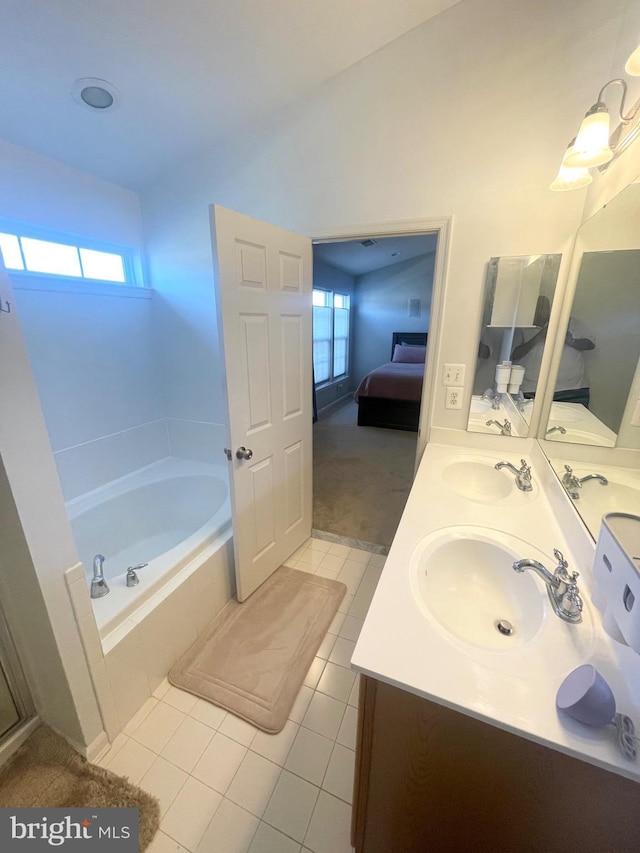 1716 Sunningdale Ln, Hanover, MD 21076 - full bath featuring ensuite bath, double vanity, tile patterned flooring, and a bath