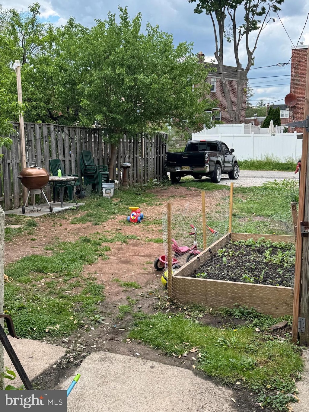 view of yard with a garden and fence