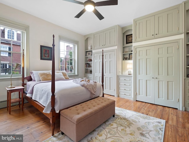13 The Strand, New Castle, DE 19720 - bedroom featuring light wood-style floors, two closets, and ceiling fan