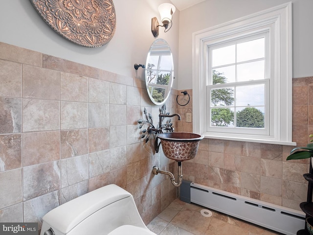 13 The Strand, New Castle, DE 19720 - bathroom featuring tile walls, a baseboard radiator, and toilet