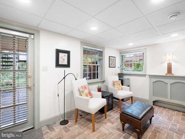 13 The Strand, New Castle, DE 19720 - living area featuring baseboards, brick floors, recessed lighting, and a drop ceiling
