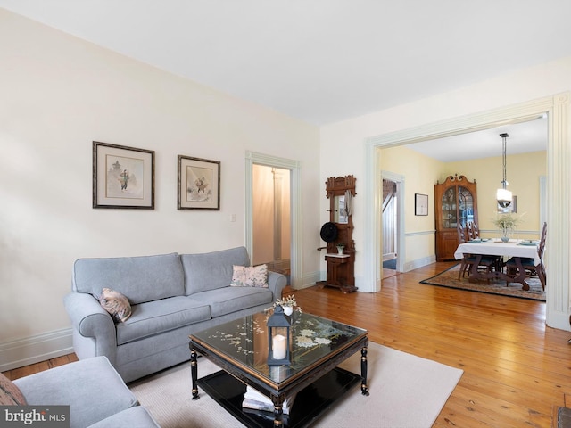 13 The Strand, New Castle, DE 19720 - living area with light wood-style flooring and baseboards
