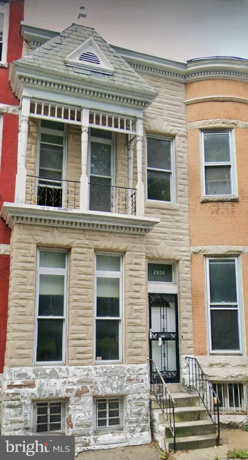 2804 Auchentoroly Ter, Baltimore, MD 21217 - view of front of home featuring a balcony and stone siding