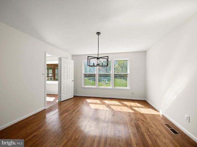 222 Springloch Rd, Silver Spring, MD 20904 - unfurnished dining area featuring wood finished floors, a chandelier, and baseboards
