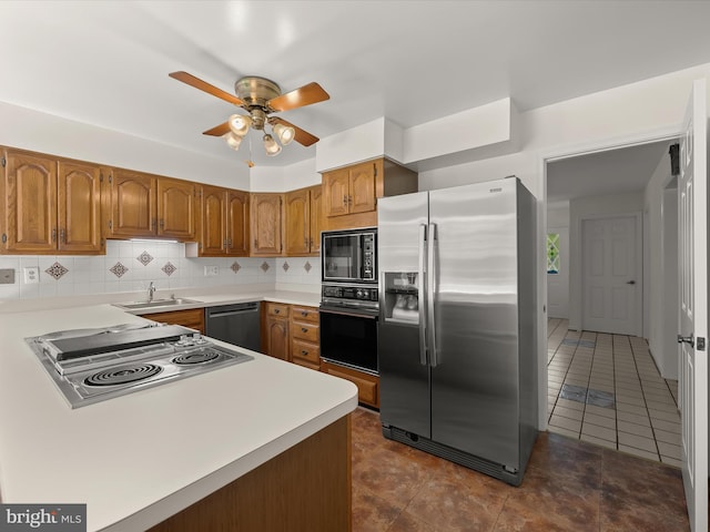 222 Springloch Rd, Silver Spring, MD 20904 - kitchen with black appliances, brown cabinets, a sink, and ceiling fan