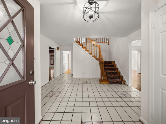 222 Springloch Rd, Silver Spring, MD 20904 - foyer entrance with light tile patterned flooring, stairs, and baseboards