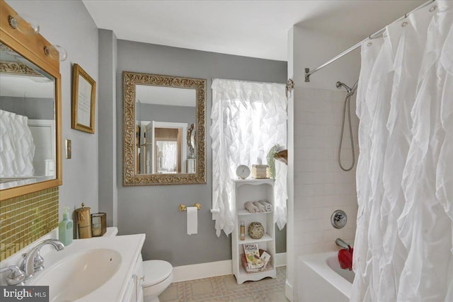 full bath featuring toilet, baseboards, vanity, and shower / bathtub combination with curtain