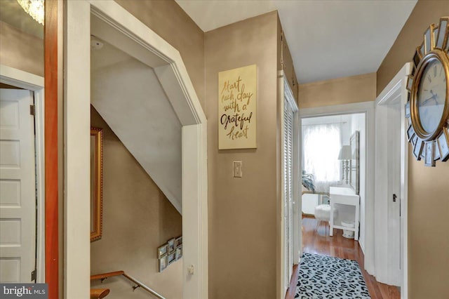 hall with wood finished floors