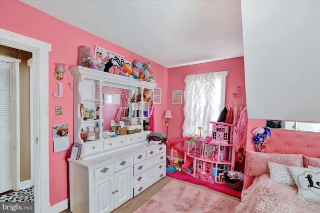 bedroom with light colored carpet