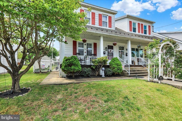 view of front facade with a porch and a front lawn