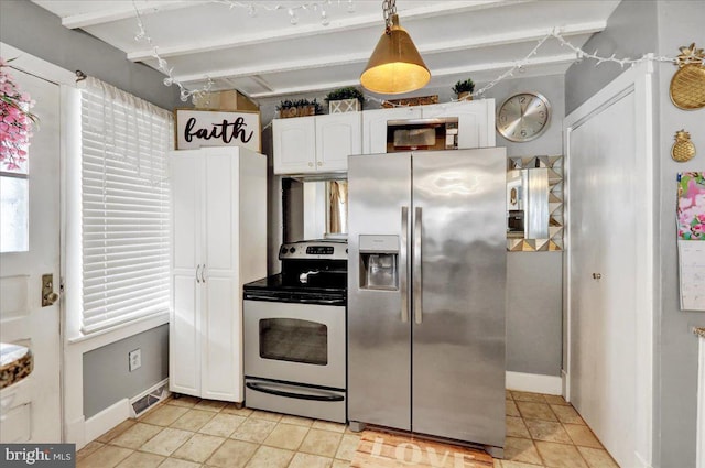 kitchen with baseboards, beamed ceiling, white cabinets, and appliances with stainless steel finishes