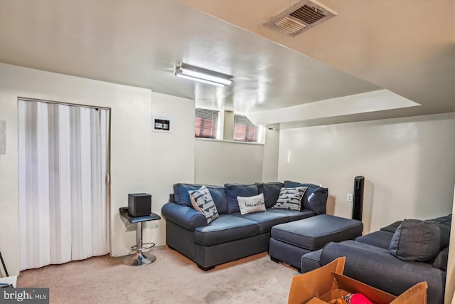 carpeted living room featuring visible vents