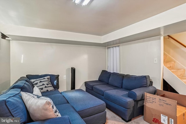 carpeted living room with stairway