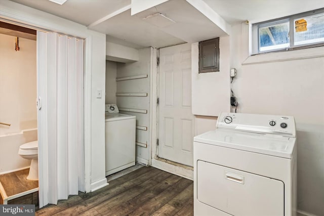 laundry room featuring electric panel, laundry area, dark wood finished floors, and independent washer and dryer