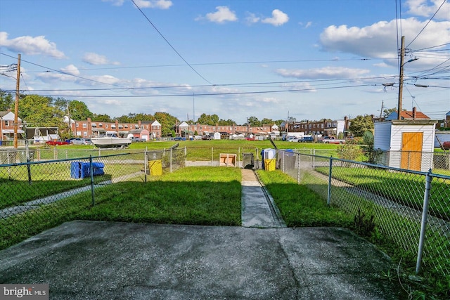 view of yard with fence and a residential view