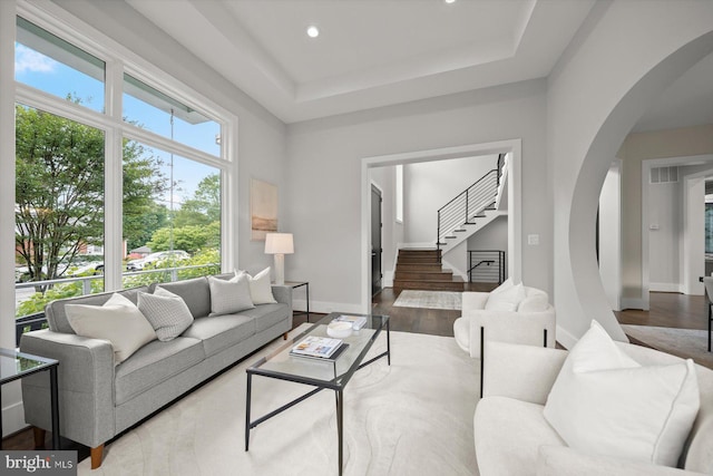 4012 N Upland St, Arlington, VA 22207 - living area featuring arched walkways, wood finished floors, stairway, recessed lighting, and a raised ceiling