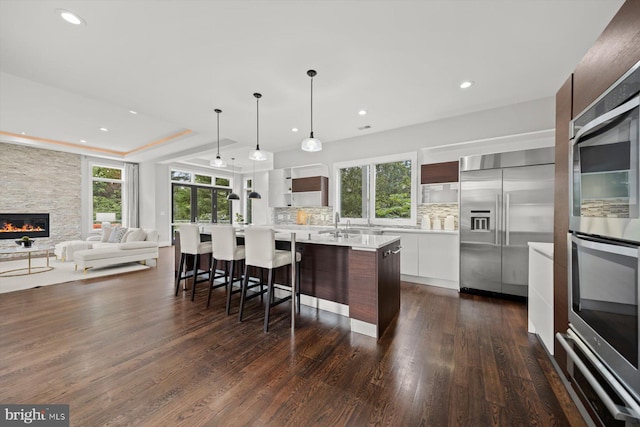 4012 N Upland St, Arlington, VA 22207 - kitchen with modern cabinets, appliances with stainless steel finishes, light countertops, plenty of natural light, and recessed lighting