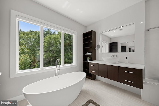 4012 N Upland St, Arlington, VA 22207 - bathroom featuring healthy amount of natural light, a freestanding tub, and vanity