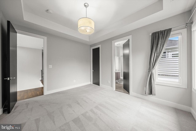 4012 N Upland St, Arlington, VA 22207 - unfurnished bedroom with a tray ceiling, carpet, baseboards, and connected bathroom