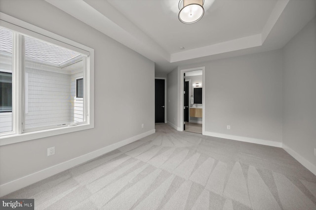 4012 N Upland St, Arlington, VA 22207 - empty room featuring light carpet, baseboards, and a tray ceiling
