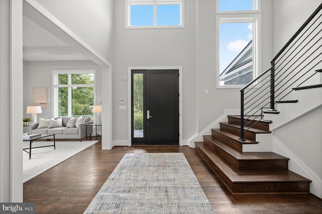 4012 N Upland St, Arlington, VA 22207 - entrance foyer featuring stairway, dark wood-style flooring, baseboards, and a towering ceiling